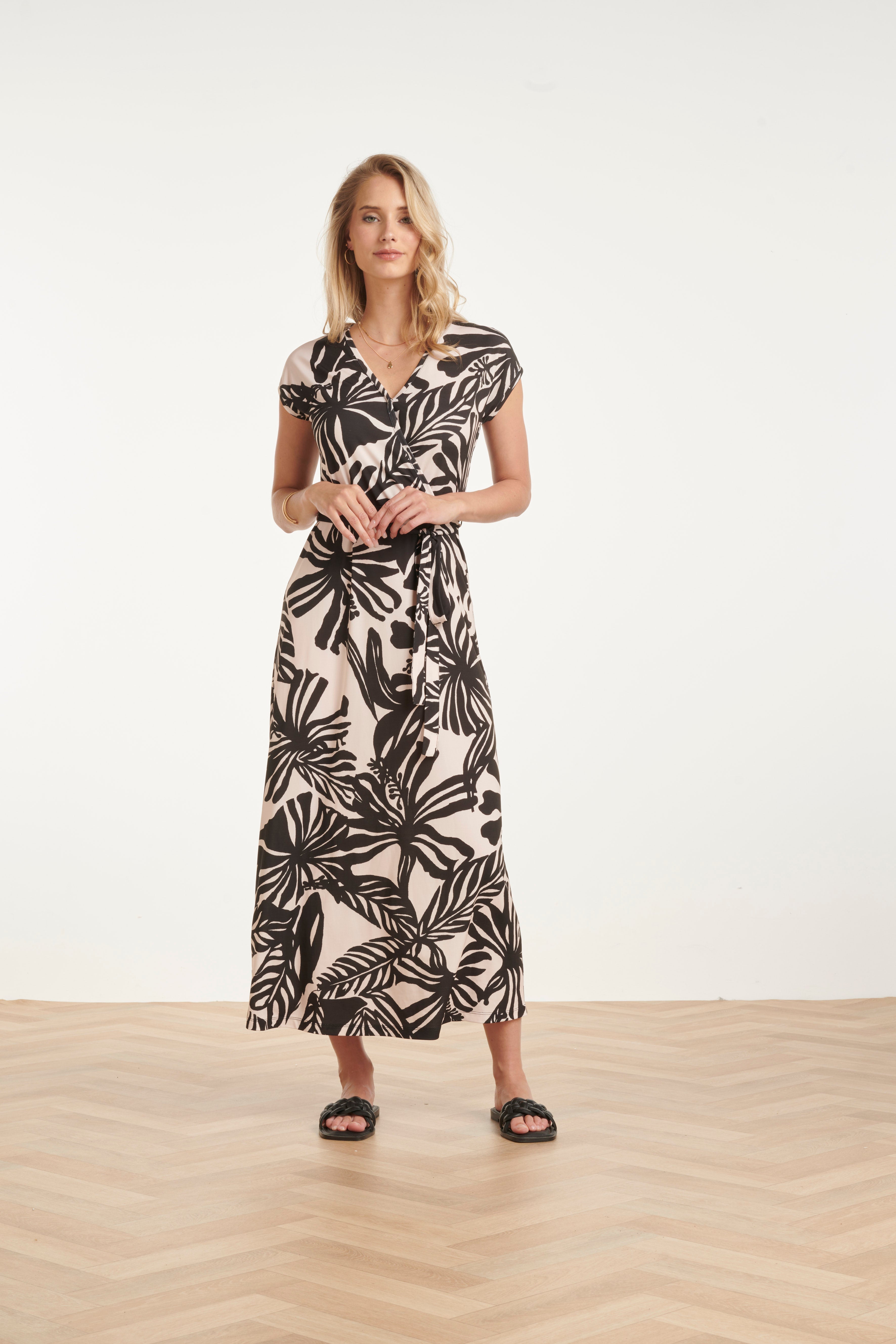 Women's black maxi dress with off-white leaf print, wrap V-neck and gathered waist tie