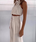 Women’s champagne co-ord set with sleeveless halter top and high-waist flared trousers