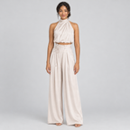 Champagne satin halter crop top and wide-leg trousers co-ord on model, front view