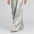 Metallic satin wide-leg trouser hem detail with pressed front seam