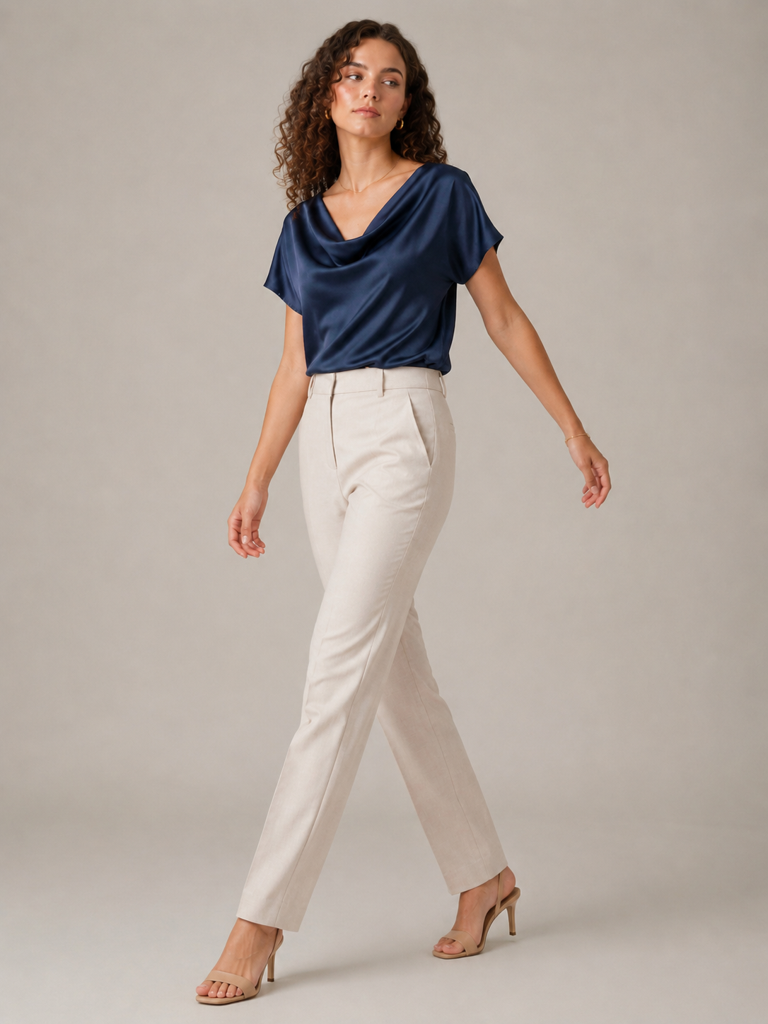 Navy satin-like draped-neck blouse with short sleeves and cowl neckline