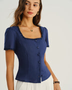 Navy square-neck blouse with lace-trim collar, short sleeves, and button front