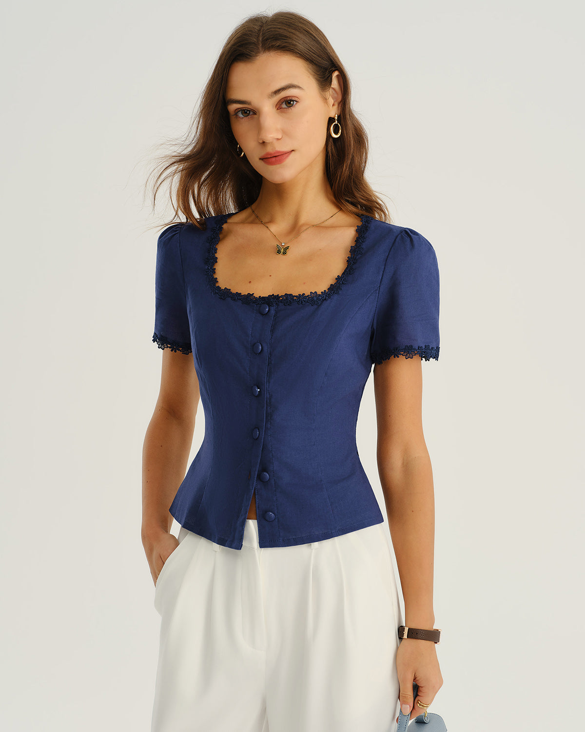 Navy square-neck blouse with scalloped lace trim, short sleeves, and button front