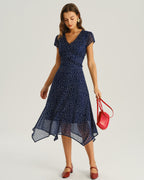 Navy blue wrap midi dress with cap sleeves and asymmetrical hem, white dot print