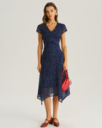 Navy blue cap-sleeve wrap midi dress with V-neck and white dot print