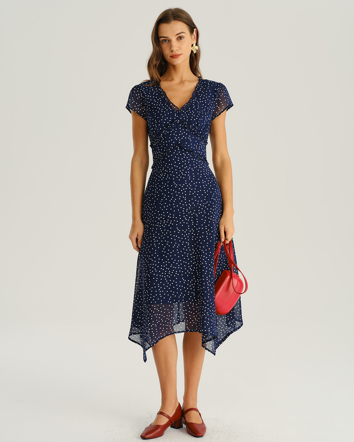 Navy blue cap-sleeve wrap midi dress with V-neck and white dot print
