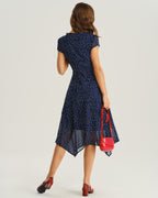 Navy blue wrap midi dress back view with cap sleeves and white dot print
