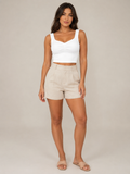 White slim-fit sleeveless tank top with V neckline and twisted front detail