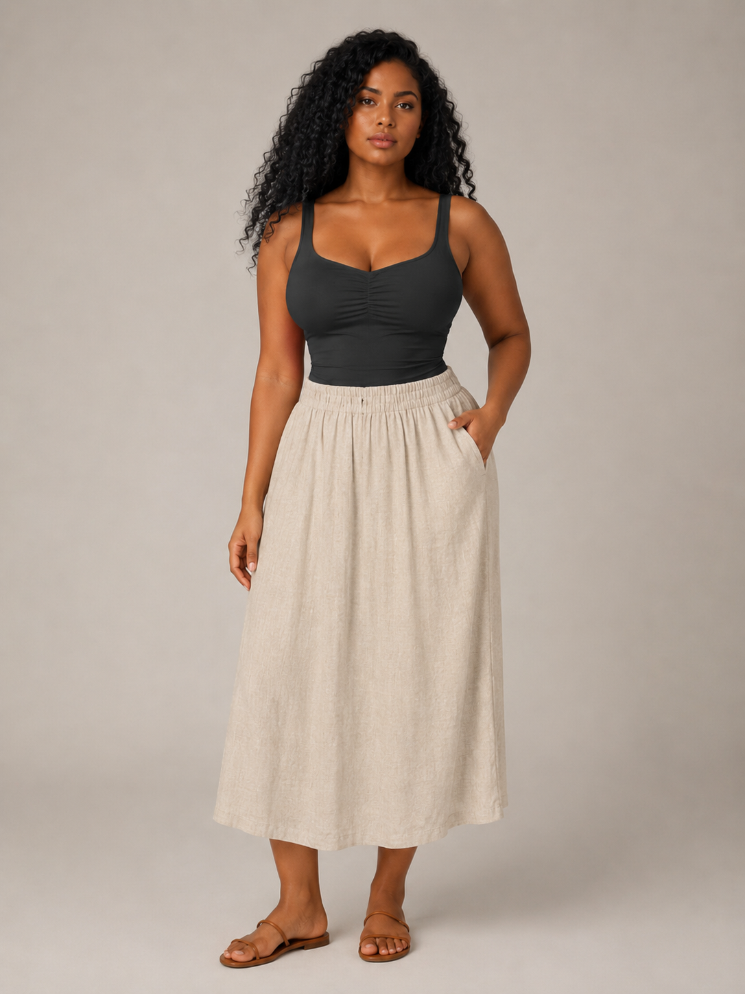 Black slim-fit sleeveless tank top with V neckline and twisted front detail