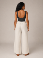 Black sleeveless slim-fit tank top, scoop back design