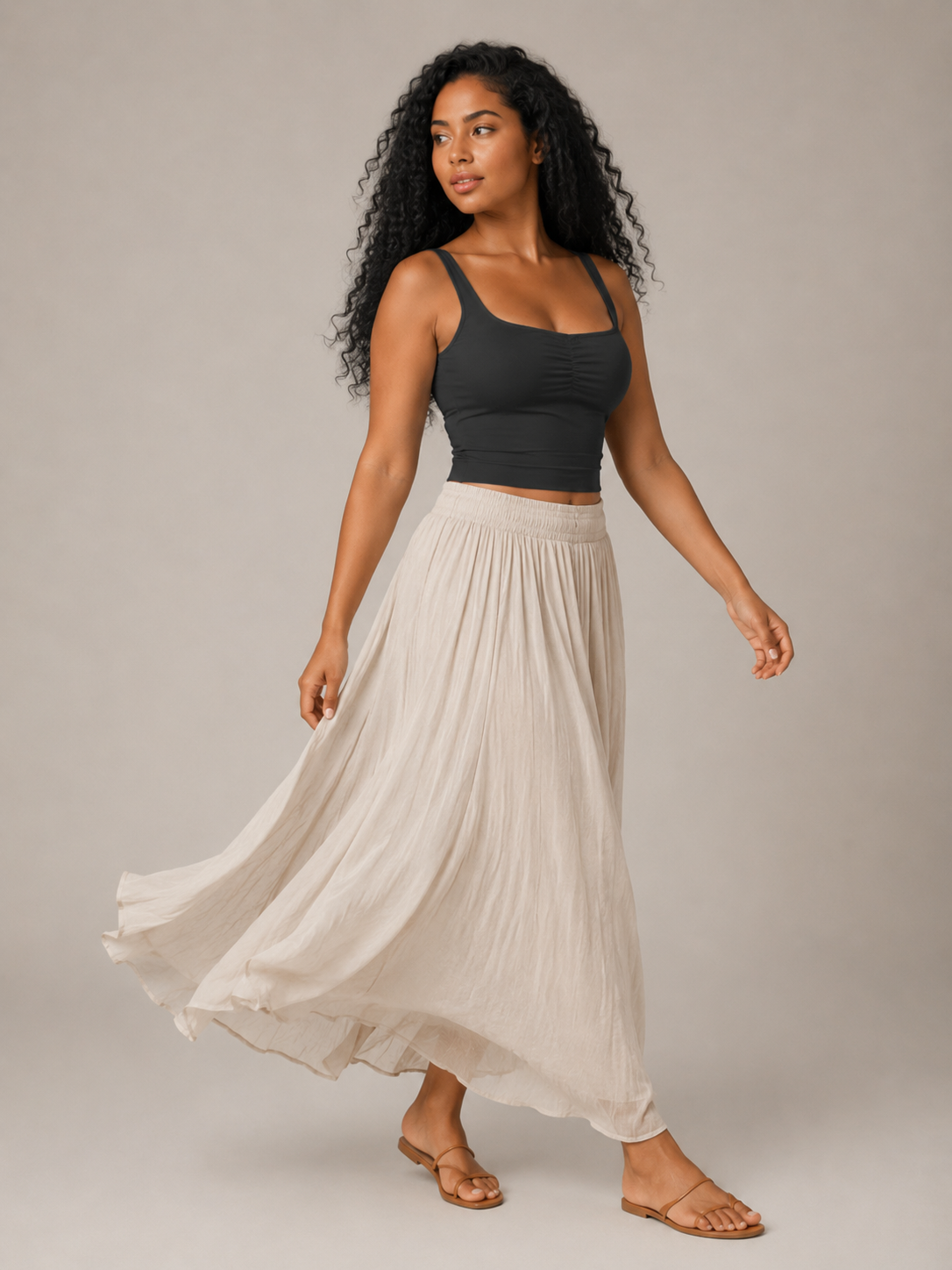 Black slim-fit sleeveless tank top with V neckline and twisted front detail