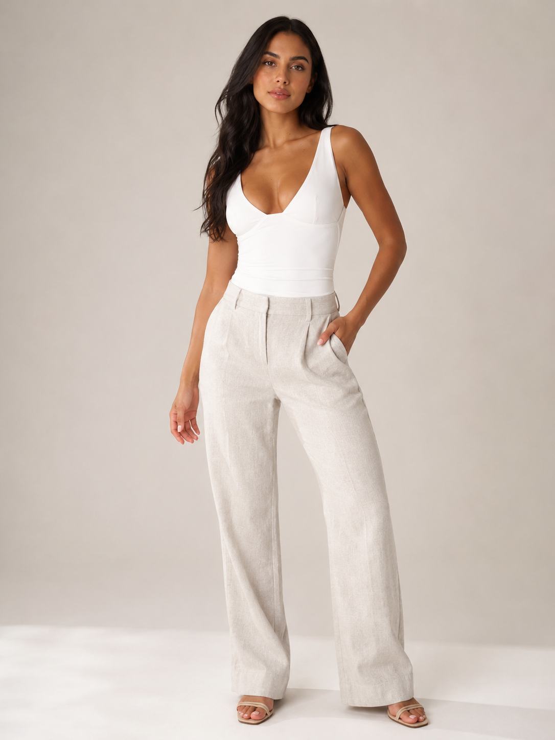 White fitted sleeveless V-neck top with smooth seam details