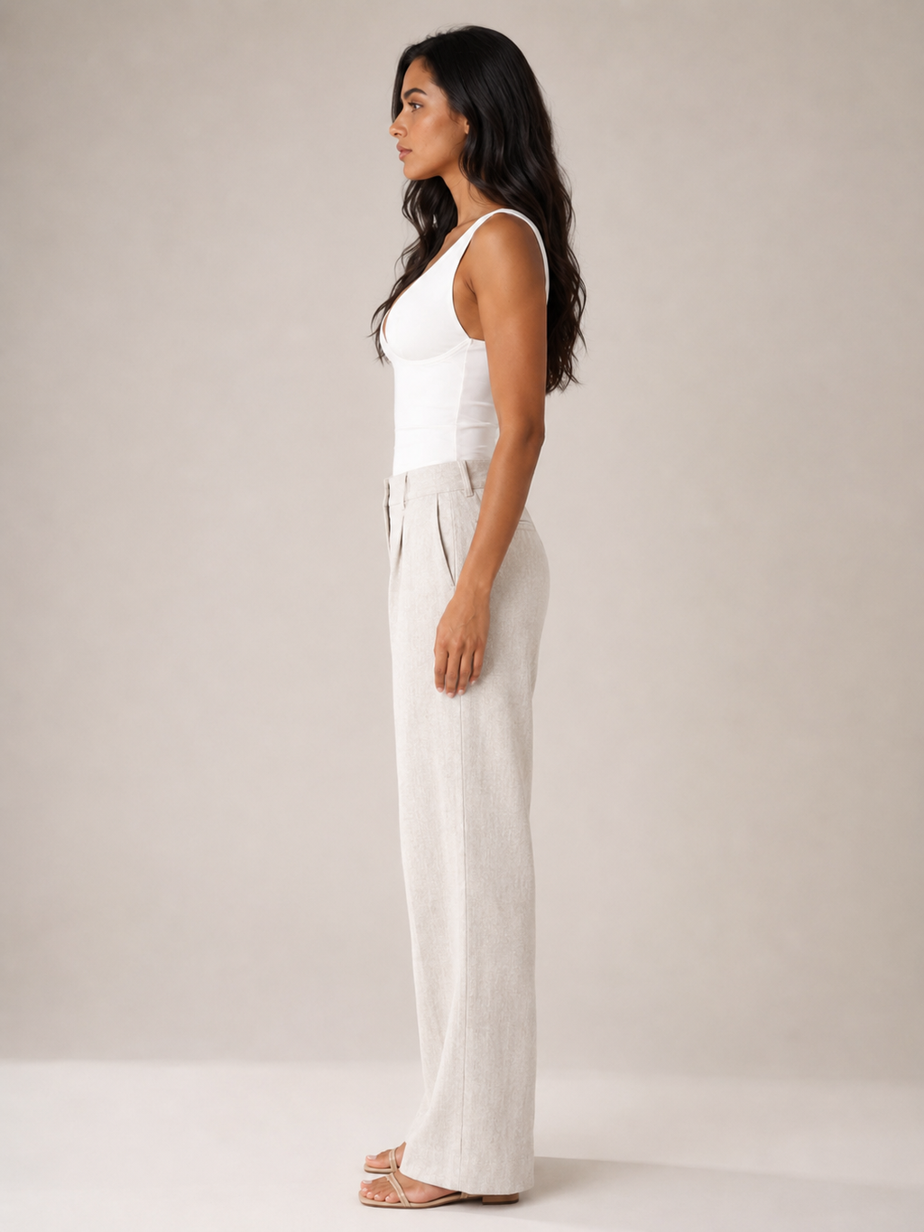White fitted sleeveless V-neck top, side profile with thin straps