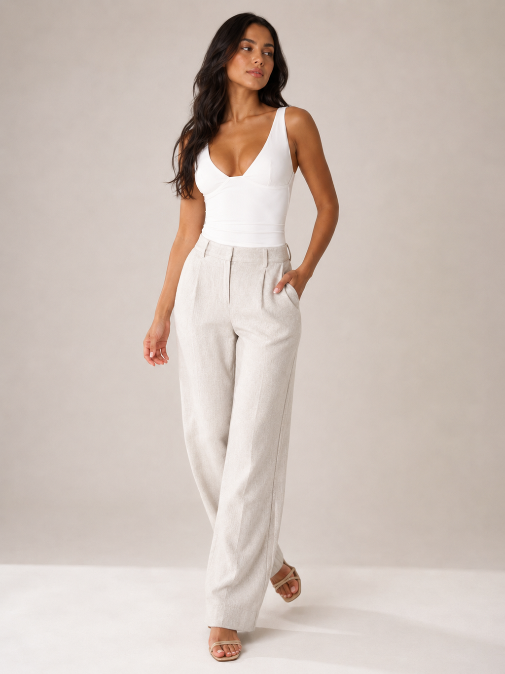 White fitted sleeveless V-neck top with contoured bust and smooth finish