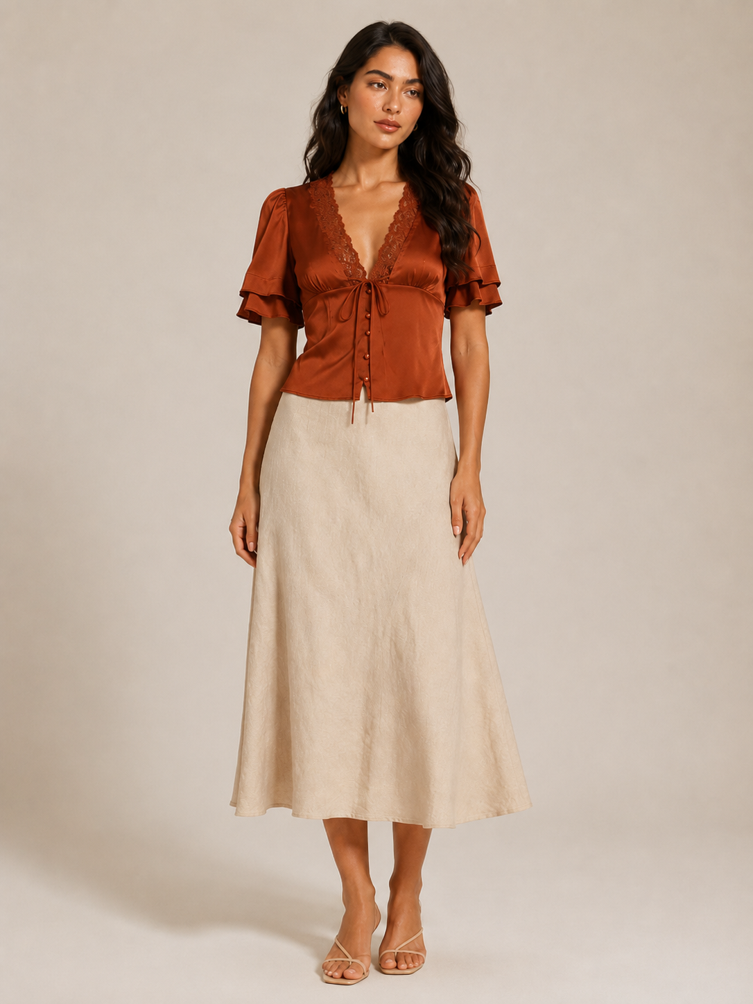 Rust lace-trim slim-fit short-sleeve top with V neckline, bow tie, and button placket