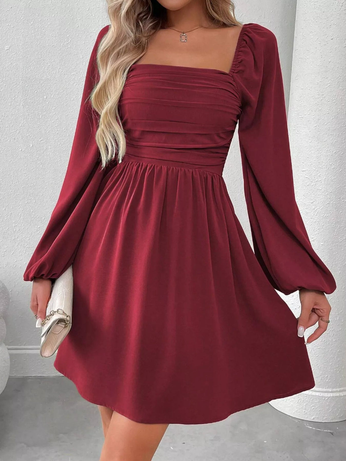 Wine red A-line dress with ruched square neckline and long puff sleeves
