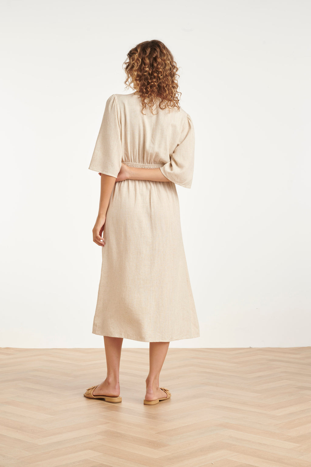 Sand midi dress back view with elastic waist and gathered back yoke, three-quarter sleeves