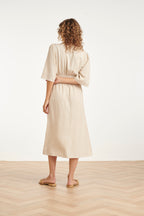 Sand midi dress back view with elastic waist and gathered back yoke, three-quarter sleeves