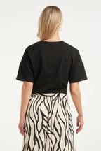 Black oversized T-shirt from back, crew neck and short sleeves