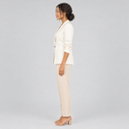 Cream one-button blazer side profile on model with beige trousers