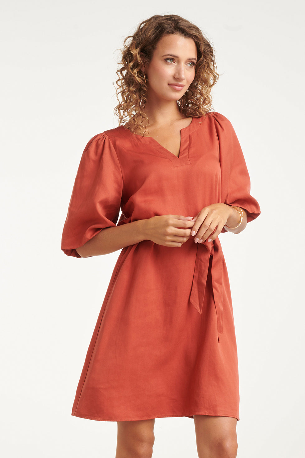 Brick V-neck A-line dress with tie belt, short puff sleeves, and gathered neckline