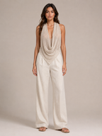 Sabria halter top in beige with cowl waterfall neckline and draped open-back design