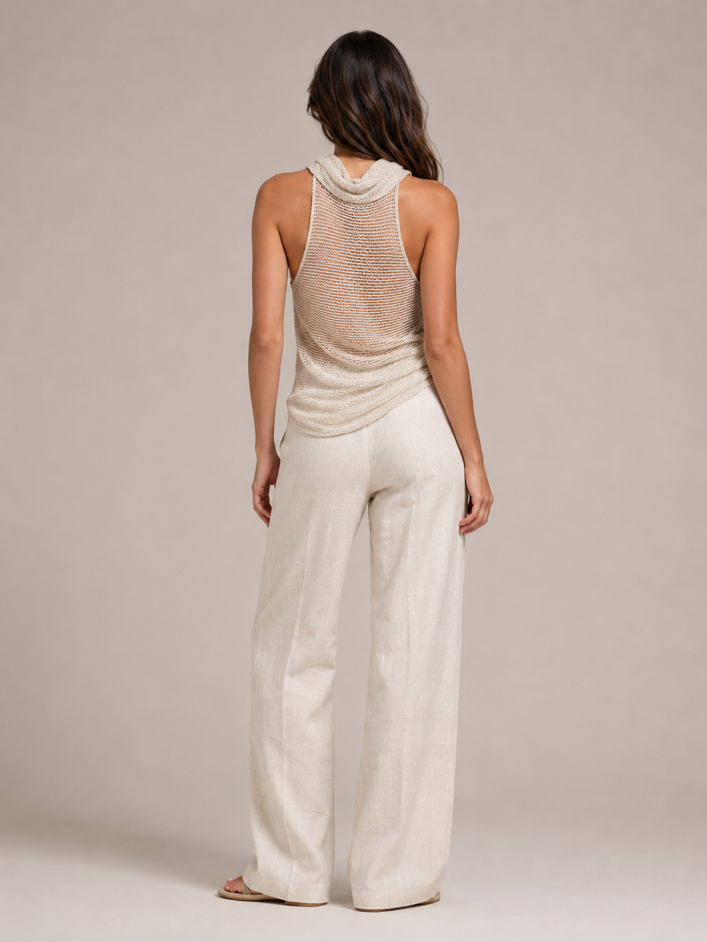 Sabria halter top in beige shown from back with open-back drape