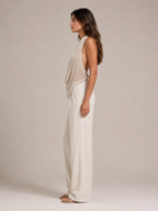 Sabria halter top in beige with open-back drape, shown from the side