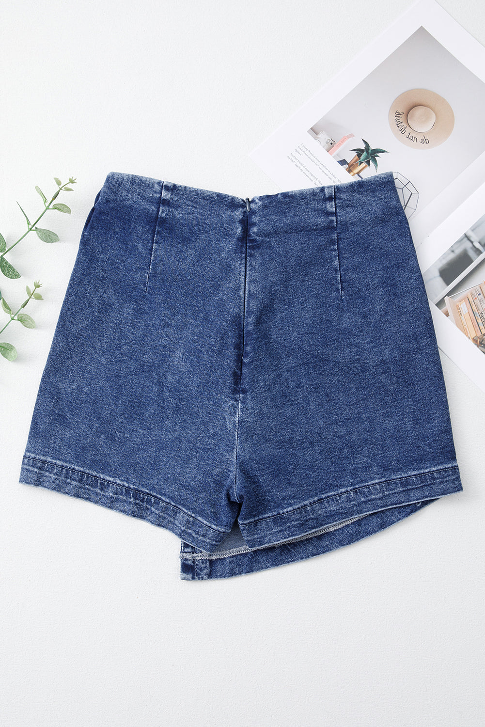 Blue acid-wash denim skort with front center seam and contoured waistband