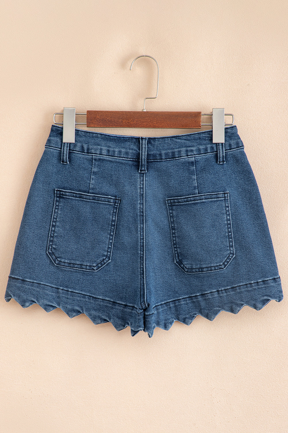 Blue denim shorts on hanger, high waist, scalloped hem, back pockets