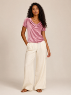 Pink velvet top with waterfall cowl neck and short sleeves, draped front.