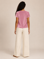 Pink velvet top with draped cowl neckline and short sleeves, back view.