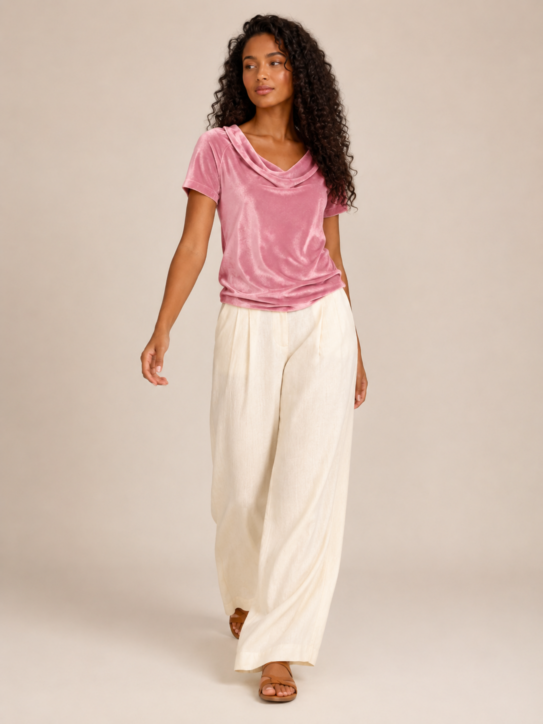Pink velvet top with waterfall cowl neck and short sleeves, loose draped fit.