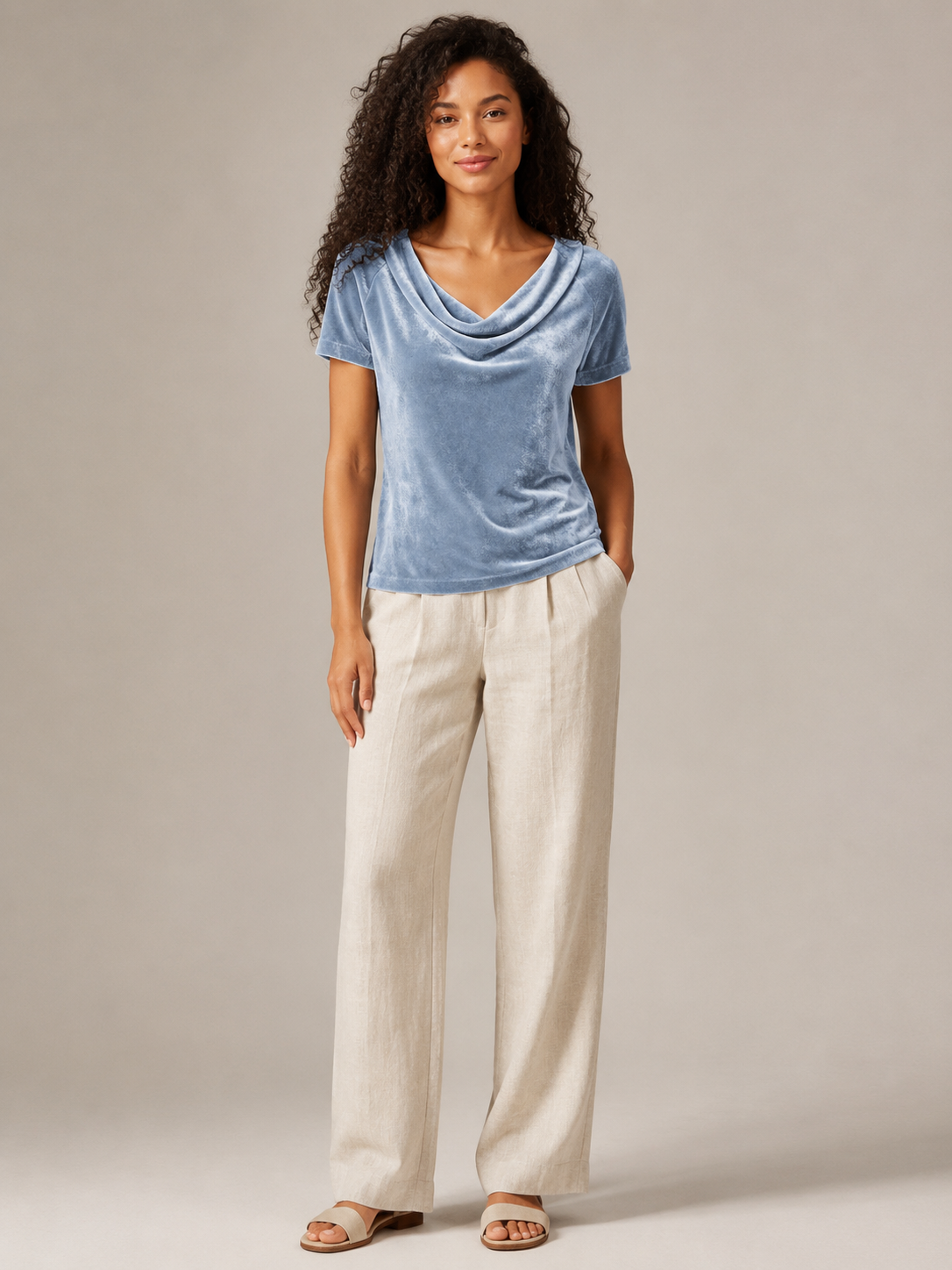 Light blue velvet top with waterfall cowl neck and short sleeves, draped front.
