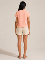 Soft apricot textured relief-structure short-sleeve crewneck top, back view