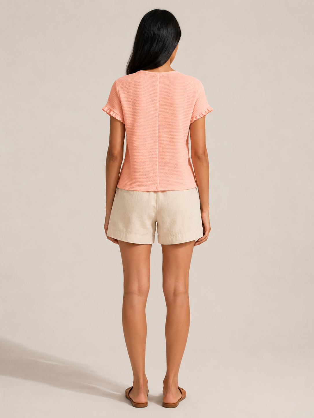 Soft apricot textured relief-structure short-sleeve crewneck top, back view