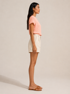 Soft apricot textured relief-structure short-sleeve crewneck top, side view