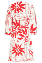 Close-up of white dress with red floral print, tie waist detail, three-quarter sleeves