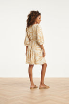 Off-white floral shift-style dress with V-neck, tied waist, and three-quarter sleeves