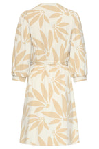Back view of off-white floral dress with V-neck seam and waist-tie detail