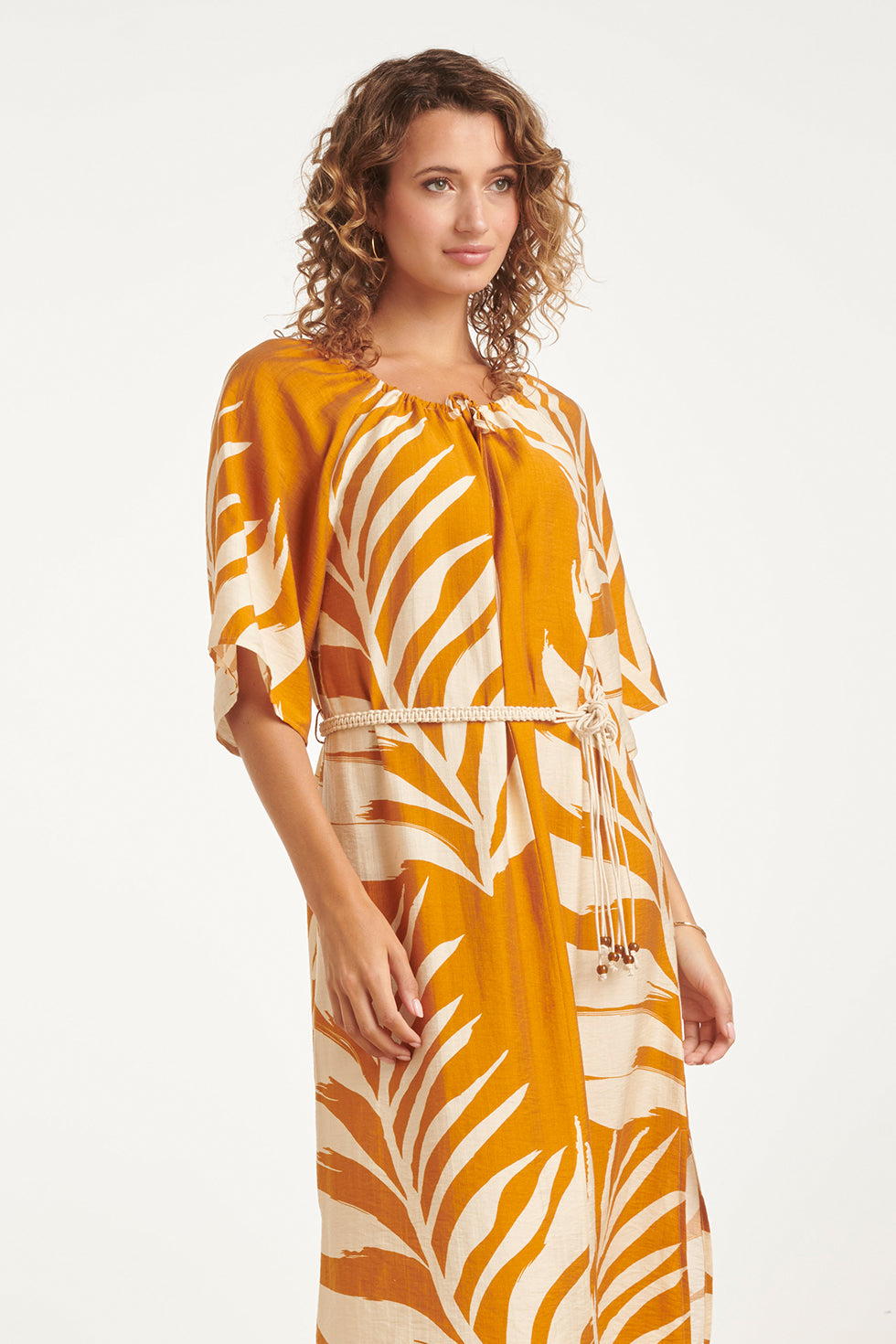 Mustard tunic dress with off-white tropical leaf print and tied waist detail