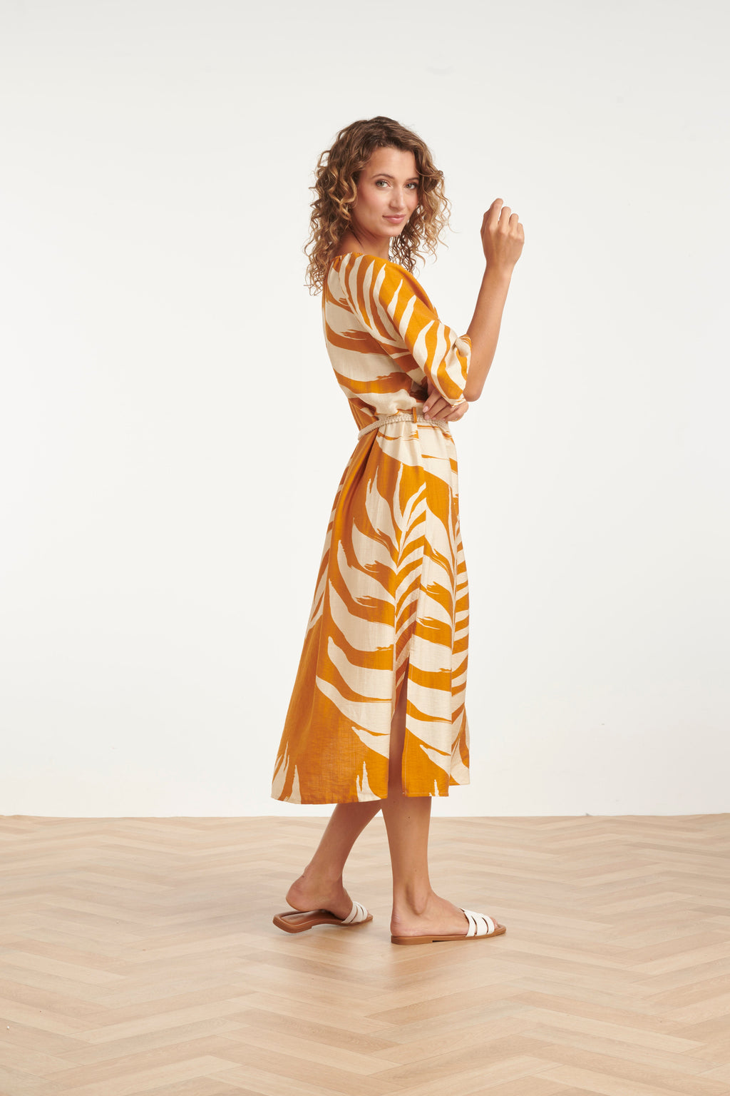Mustard leaf-print tunic dress with adjustable waist tie and midi length