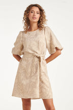 Light sand leaf-print dress with puff sleeves, round neck, and tied waist belt.