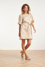 Short puff-sleeve leaf-print mini dress with tied waist belt and round neckline.