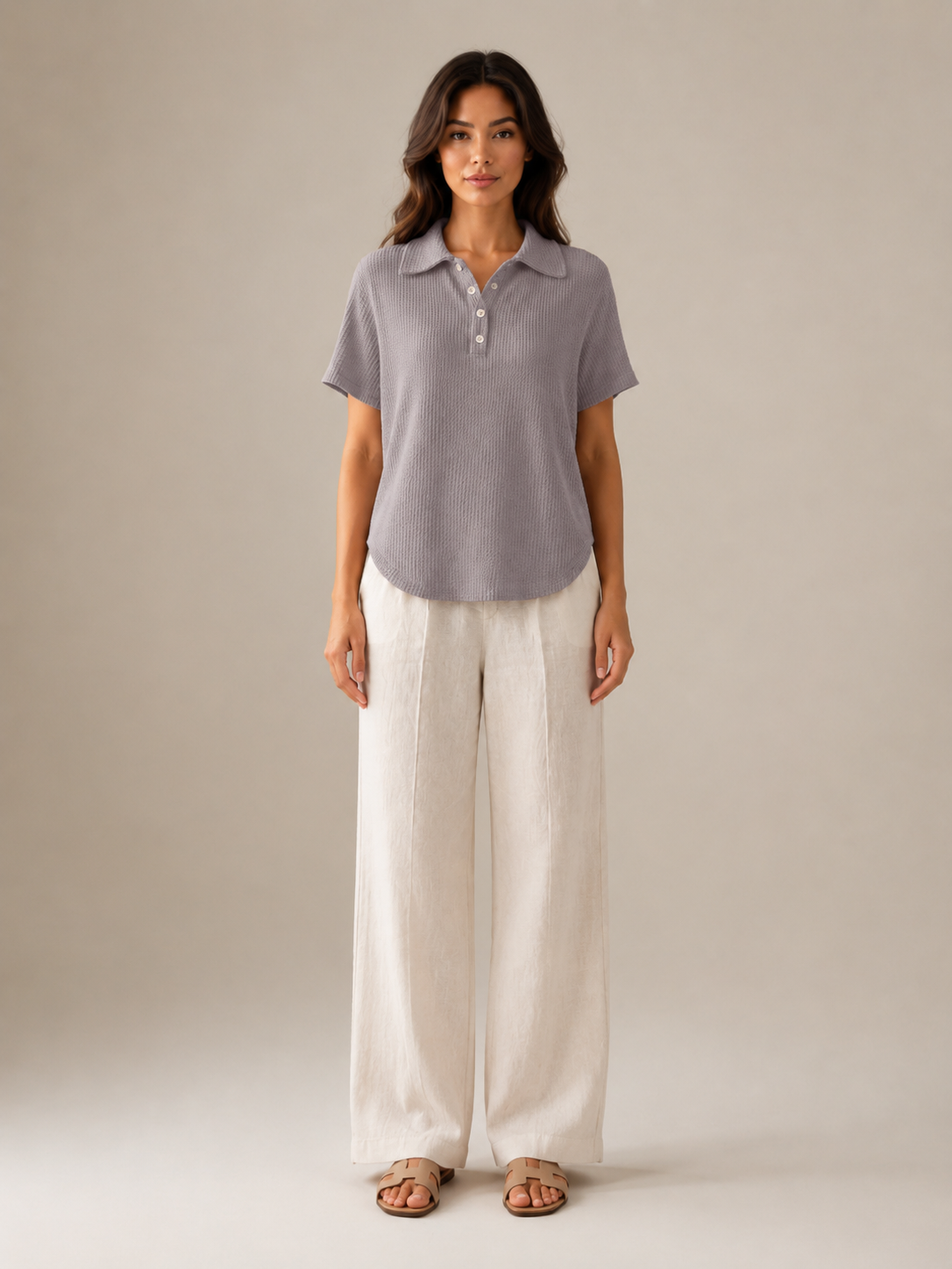 Gray women's polo shirt front view with three-button placket and short sleeves