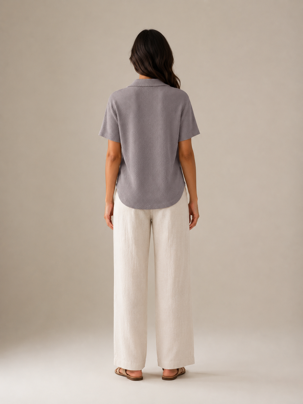 Gray women's polo shirt with short sleeves and collar, back view