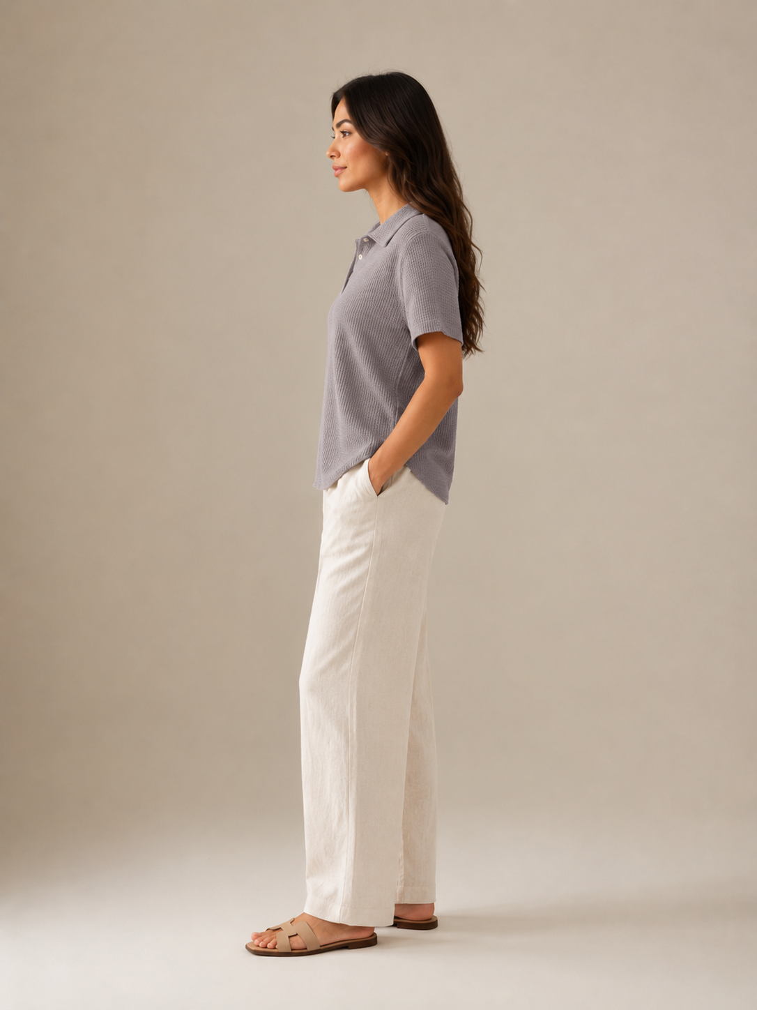 Gray women's polo shirt with button placket, short sleeves, side profile