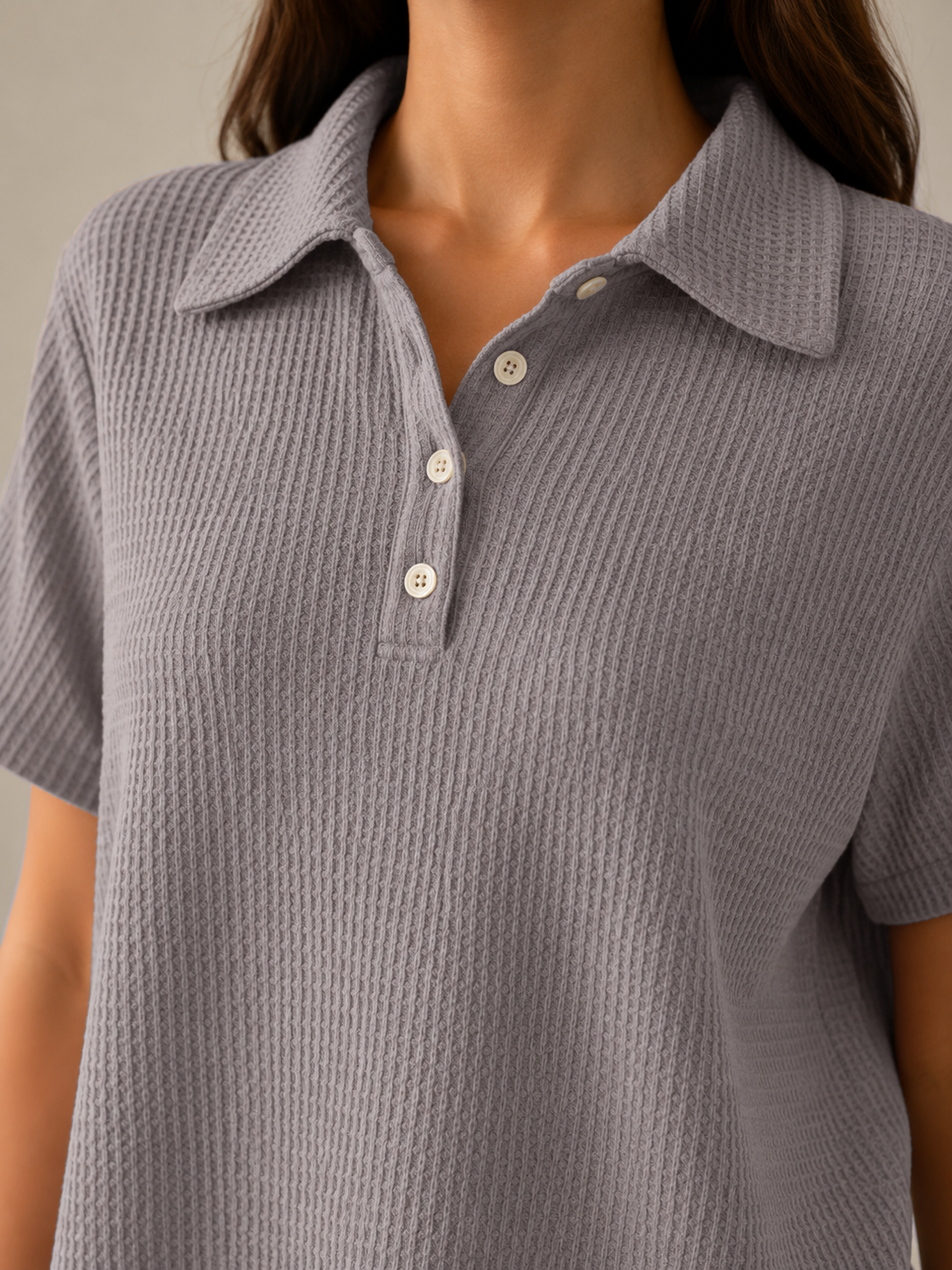 Gray polo shirt collar with button placket and textured knit fabric