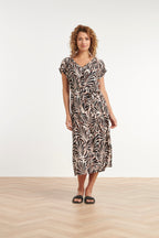 Palm print maxi dress with V-neck, short sleeves, and waist belt in cream and dark brown.