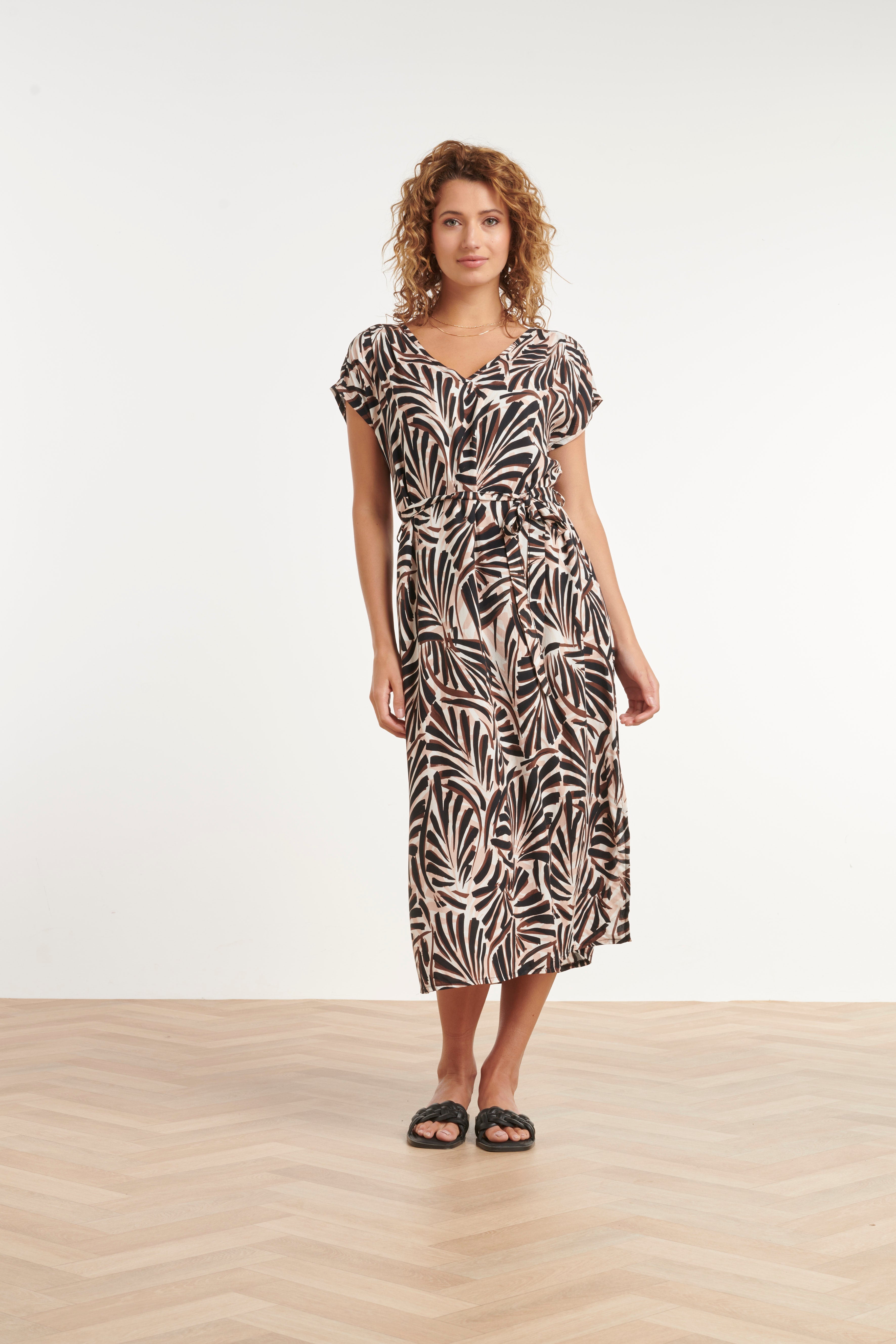 Palm print maxi dress with V-neck, short sleeves, and waist belt in cream and dark brown.
